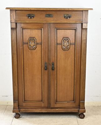 an image of a wooden cabinet with two doors and a door handle