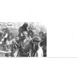 black and white photograph of a group of people standing in a crowd