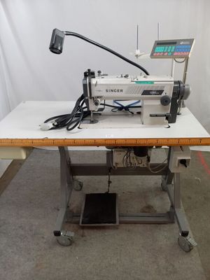a sewing machine that is sitting on a table