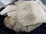 a picture of a pair of shoes and a dress on a bed