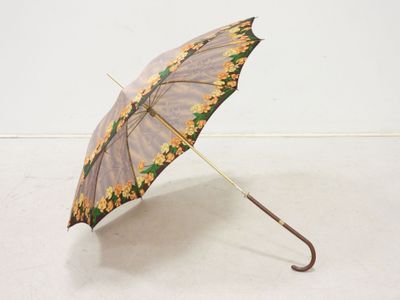 an umbrella that is sitting on the floor in the room
