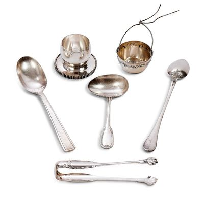 a lot of silver spoons and spoons on a white surface