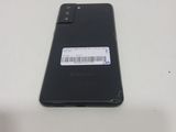 a close up of the back of a black phone with a barcode on it