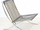 an image of a modern lounge chair made of metal