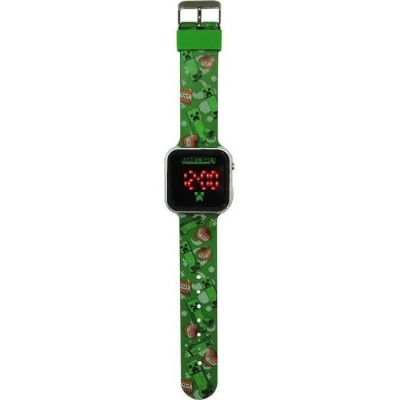 un gros plan d'une montre avec un bracelet vert