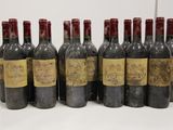 six bottles of wine are lined up in a row on a table