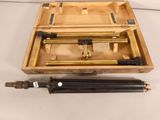 a wooden box with a pair of tools inside of it