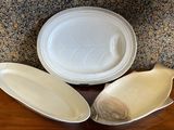 three plates and a bowl sitting on a table