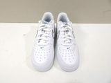 white nike air force sneakers with blue accents on a white surface
