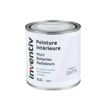 le pot de peinture est posé sur une surface blanche