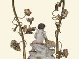 a statue of a woman sitting on top of a table