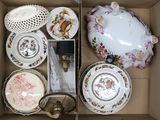 a box with a variety of china items in it