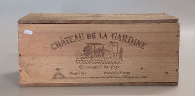 a wooden box with a label on it that says chateau de la gardine