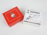 a small red box with a picture of a woman on it