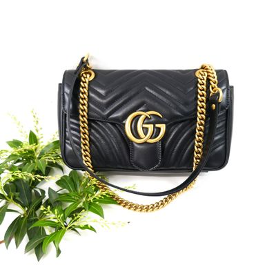 guccissi black leather shoulder bag with gold hardware and chain