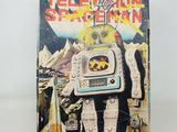 a close up of a book on a white surface with a picture of a robot on it