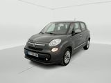 the small black car is parked in a white room
