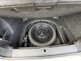 a sub in the trunk of a car with a speaker in it