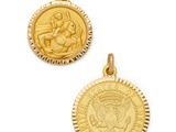 a close up of two gold medallions on a white background