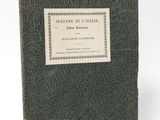 the front cover of a book with a label on it