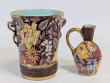 two vases sitting next to each other on a table