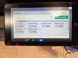 a tablet computer that is being held up in the air