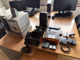 a desk with a lot of electronics on top of it