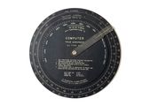 a clock that has a black dial on it