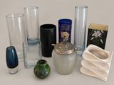 many different glass vases and vases on the table