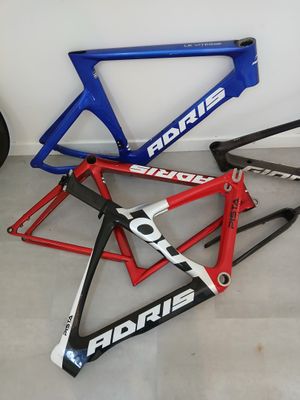 three bikes are lined up on the floor next to each other