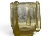 a glass vase with a handle on a white background