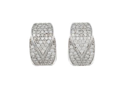 a pair of diamond earrings on a white background