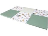 housse de matelas à langer verte et blanche avec des animaux et des fleurs