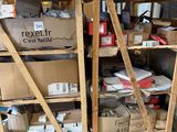 boxes and boxes are stacked on a shelf in a warehouse