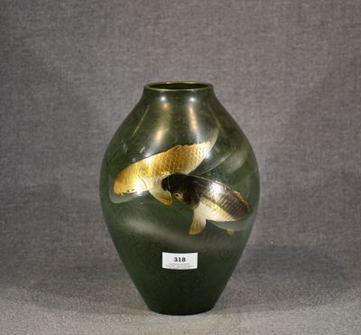 a green vase with gold fish in it on a gray background