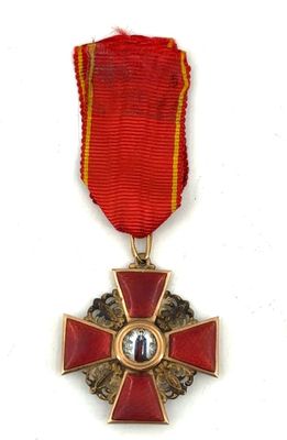 an image of a red and gold medal with a red ribbon around it