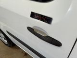a close up of a car door handle with a clock on it