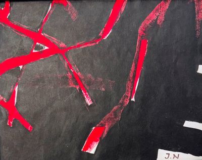 une photo d'un tableau recouvert de peinture rouge
