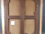 an old picture frame with a window in the middle of it