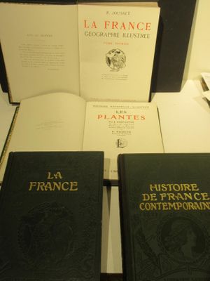two books are sitting on a table next to each other