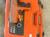 an orange tool box with a hammer on top of it