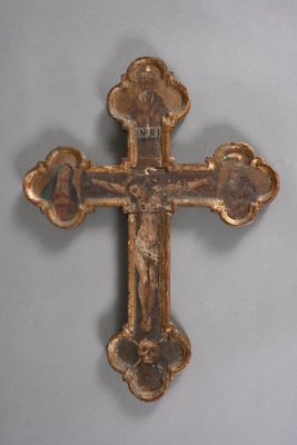 an old wooden cross with an image of jesus on it
