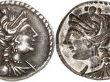 a silver coin with an image of a woman on it