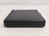 the back of a black dvd player sitting on a white surface