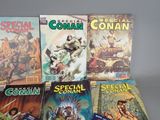 a lot of comic books that are on the table