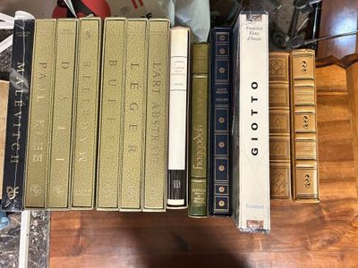 a lot of books that are on a table