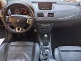 the interior of a car with a steering wheel, dashboard, and dashboard controls