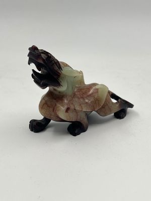 an image of a figurine of a dog with its mouth open