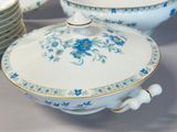 many plates and bowls with blue flowers on them