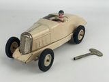 a toy car with a key on the side of it